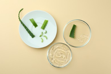 Photo of Flat lay composition with Petri dishes and aloe vera on beige background