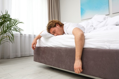 Handsome young man sleeping on pillow at home. Bedtime