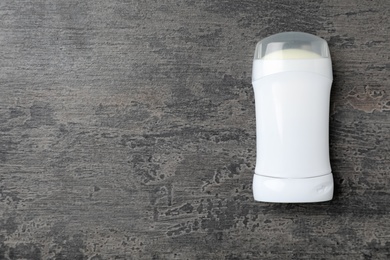 Photo of Deodorant on dark background, top view. Skin care