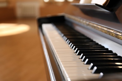 Black and white piano keys indoors, closeup