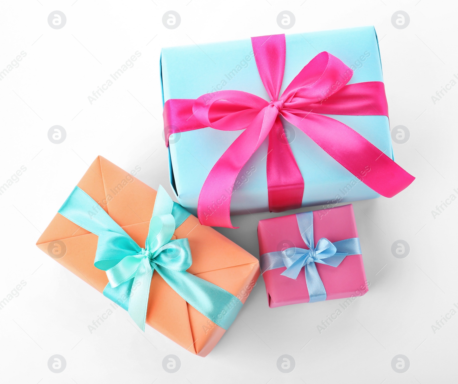 Photo of Beautiful gift boxes with ribbons on white background