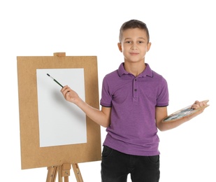 Photo of Child painting picture on easel against white background. Space for text