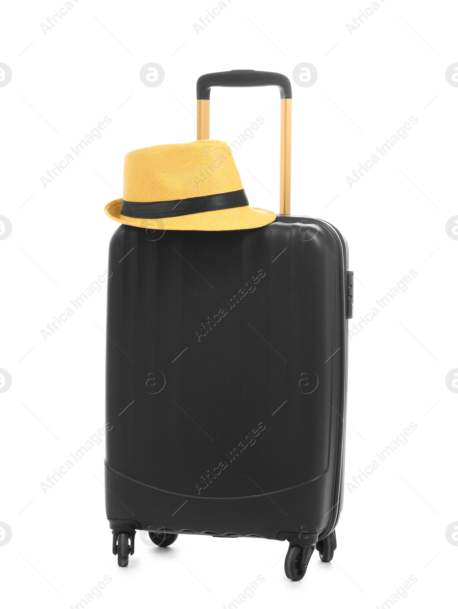 Photo of Black suitcase and hat packed for journey on white background