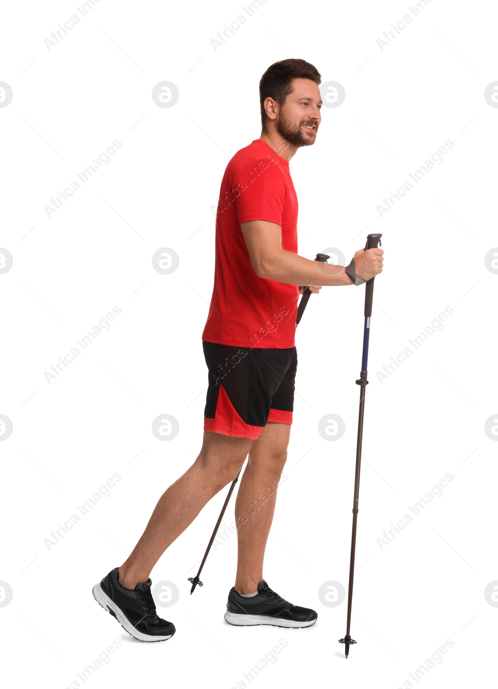 Photo of Man practicing Nordic walking with poles isolated on white