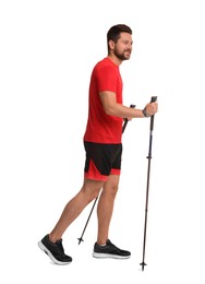 Photo of Man practicing Nordic walking with poles isolated on white