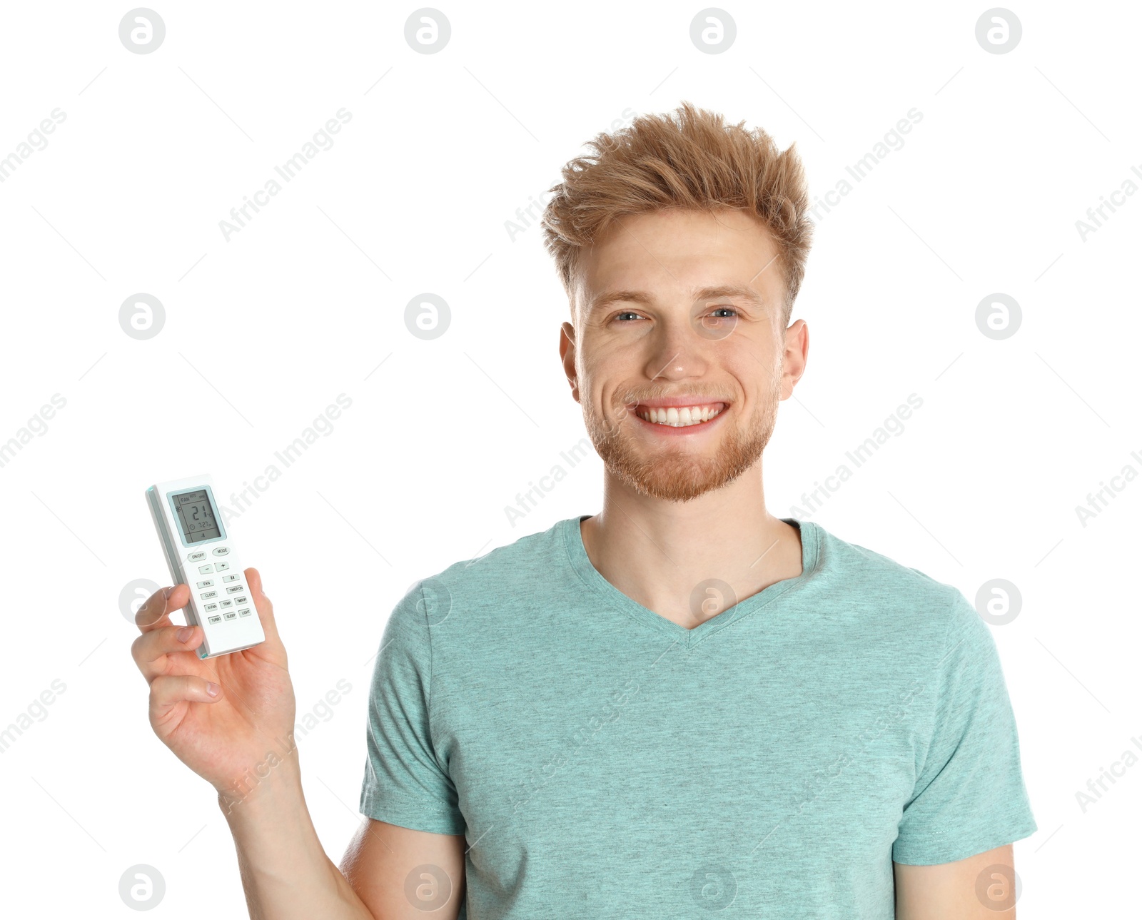 Photo of Young man with air conditioner remote on white background