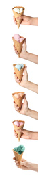 People with delicious ice creams in wafer cones on white background, closeup