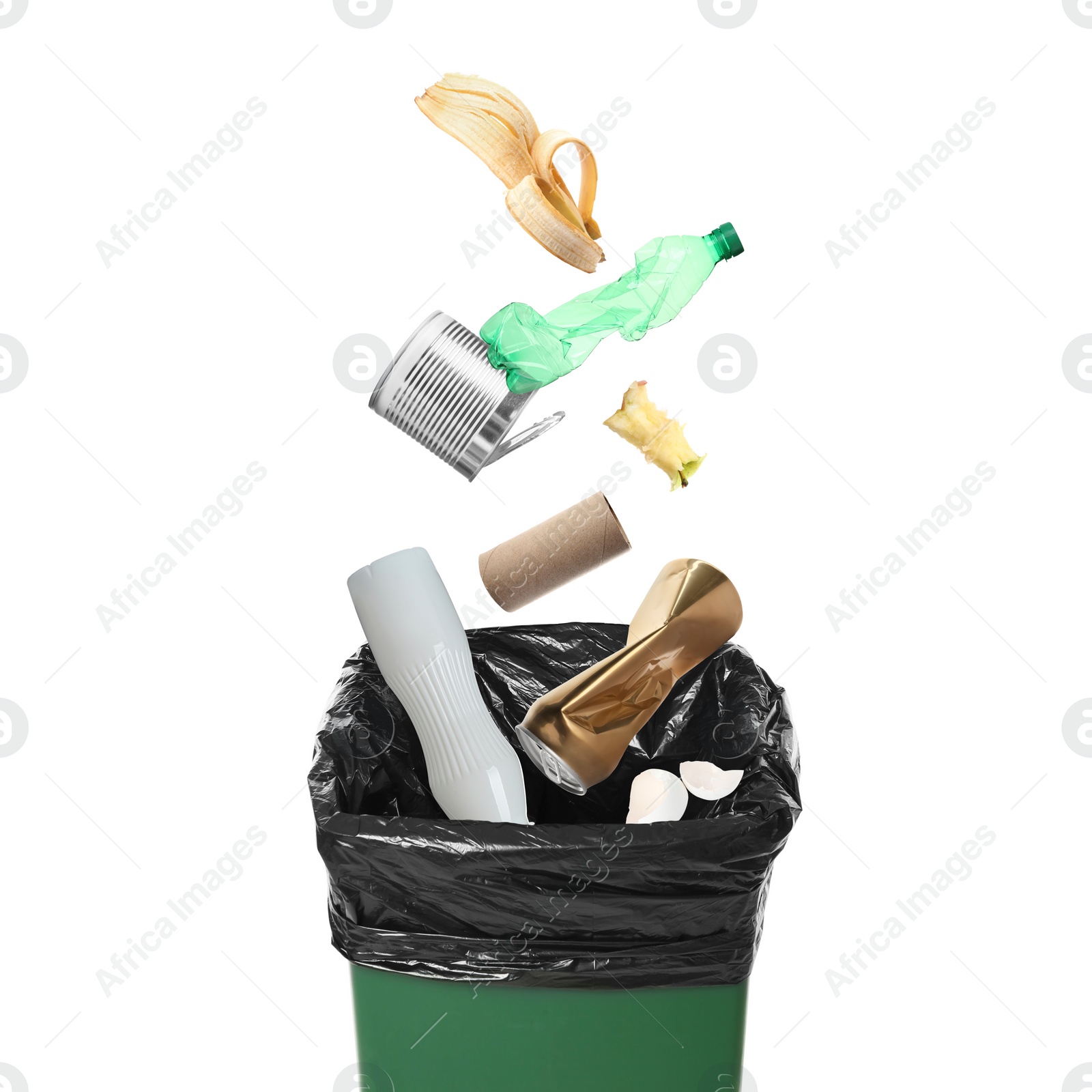 Image of Garbage falling into trash bin on white background