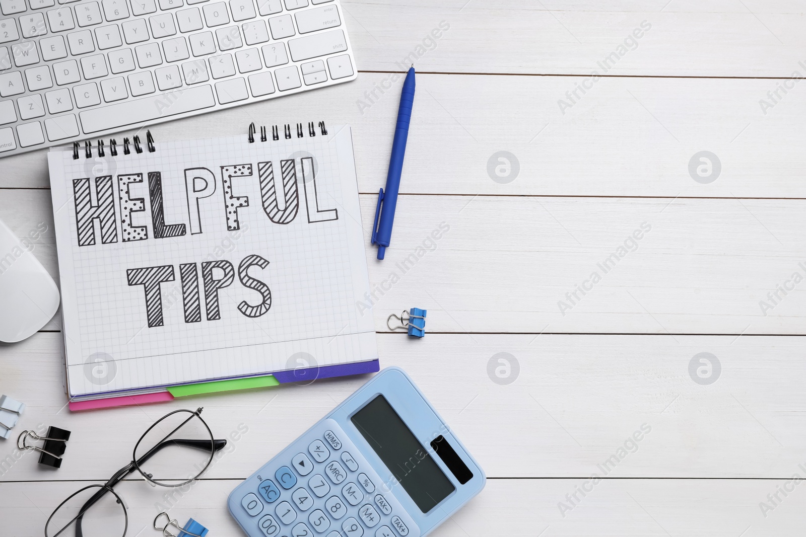Photo of Helpful Tips. Flat lay composition with notebook, calculator and computer keyboard on white wooden table, space for text