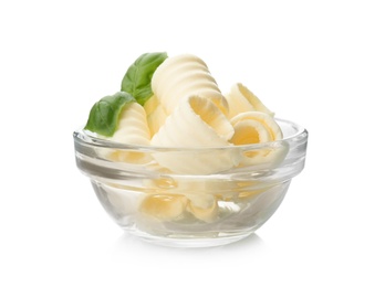 Photo of Bowl with tasty butter curls on white background