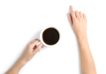 Woman holding cup of coffee on white background, top view