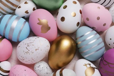 Photo of Beautifully painted Easter eggs as background, top view