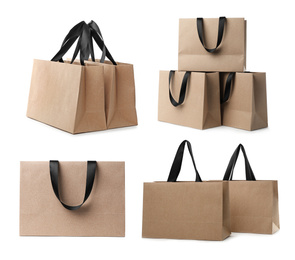Image of Set with kraft paper shopping bags on white background