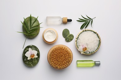 Photo of Flat lay composition with different spa products on white background