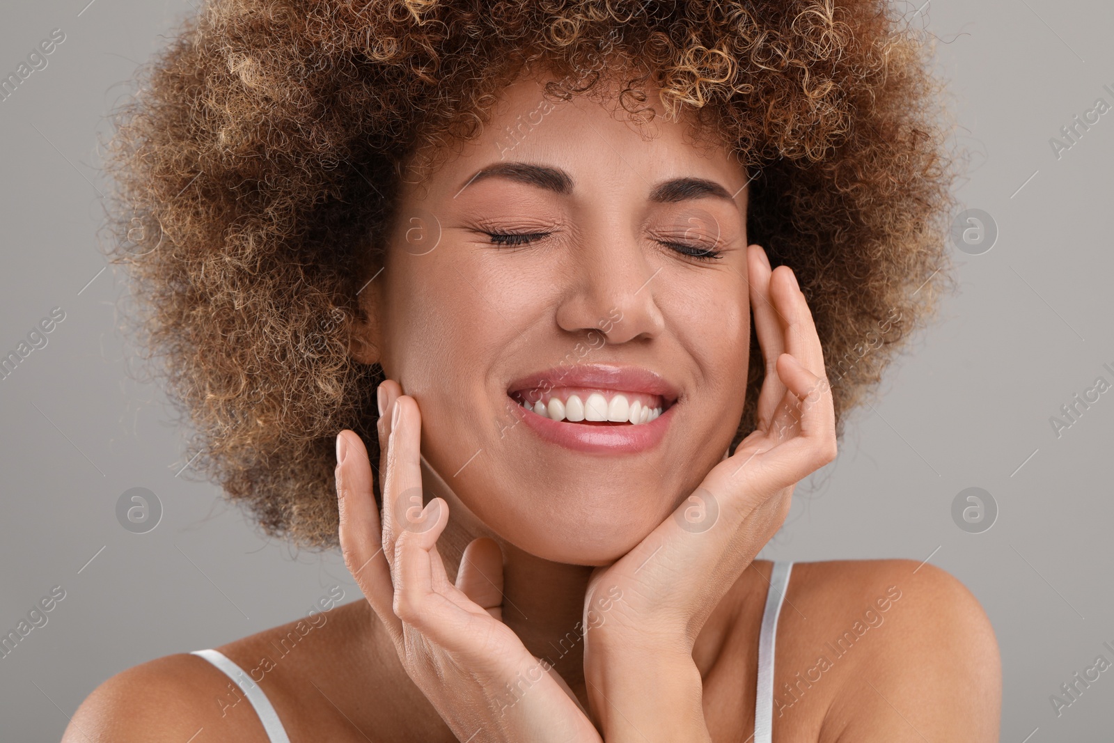 Photo of Beautiful woman with healthy skin on gray background