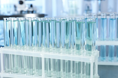 Test tubes with liquid on blurred background. Laboratory analysis