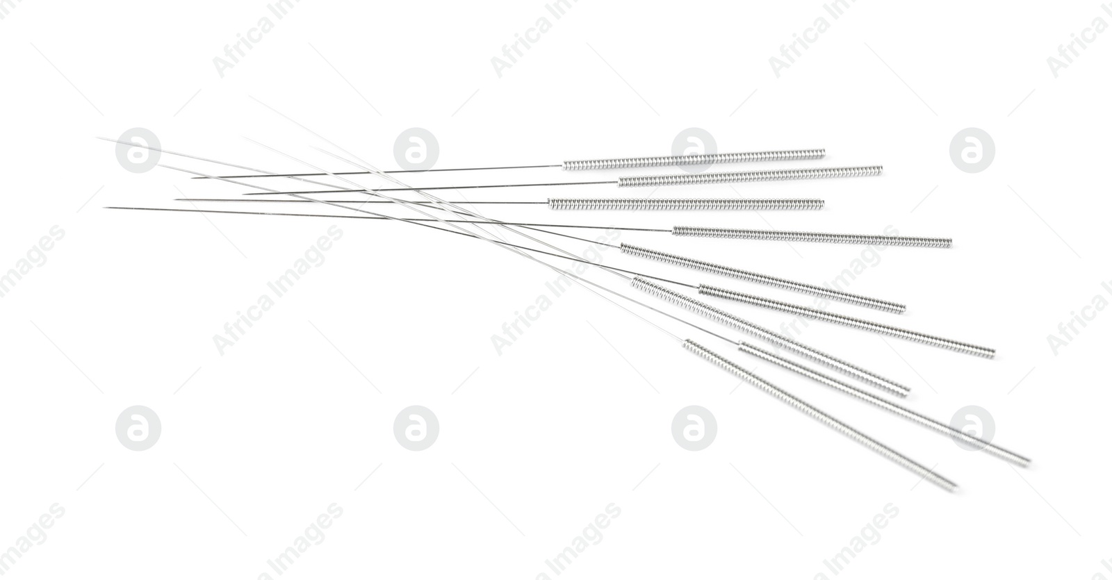 Photo of Many needles for acupuncture on white background