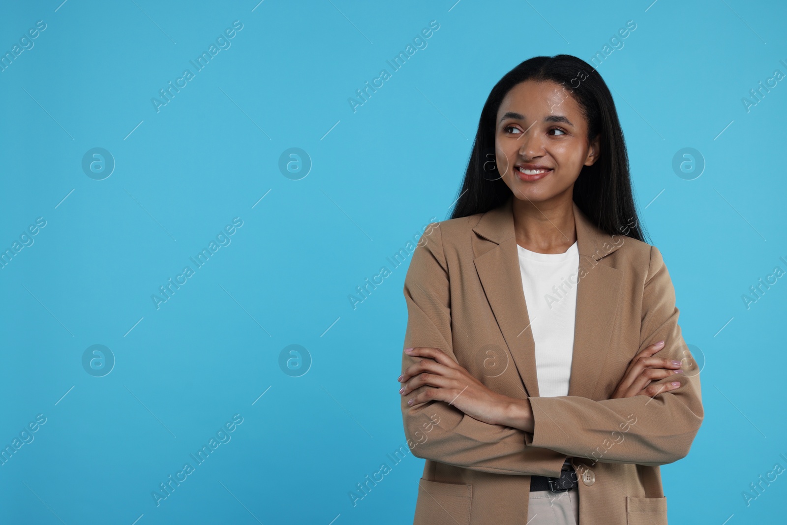 Photo of Beautiful secretary on light blue background, space for text