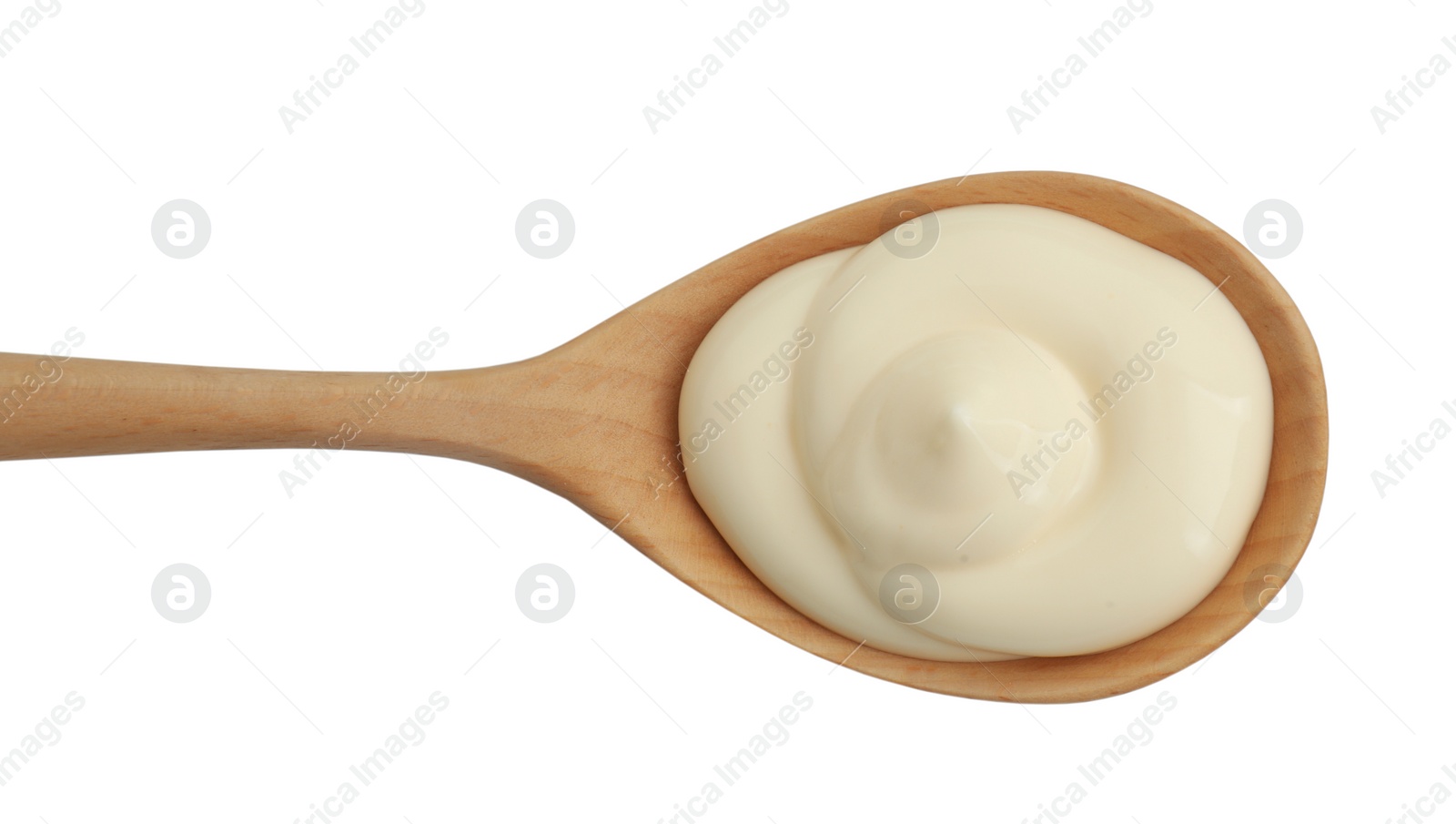 Photo of Fresh mayonnaise sauce in wooden spoon isolated on white, top view