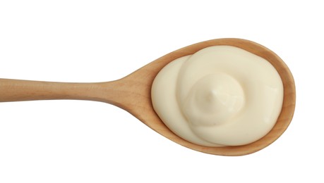 Fresh mayonnaise sauce in wooden spoon isolated on white, top view