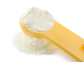 Photo of Powdered infant formula and measuring scoop on white background, closeup. Baby milk