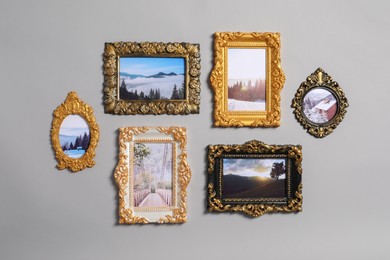 Vintage frames with beautiful photos of landscapes hanging on light gray wall