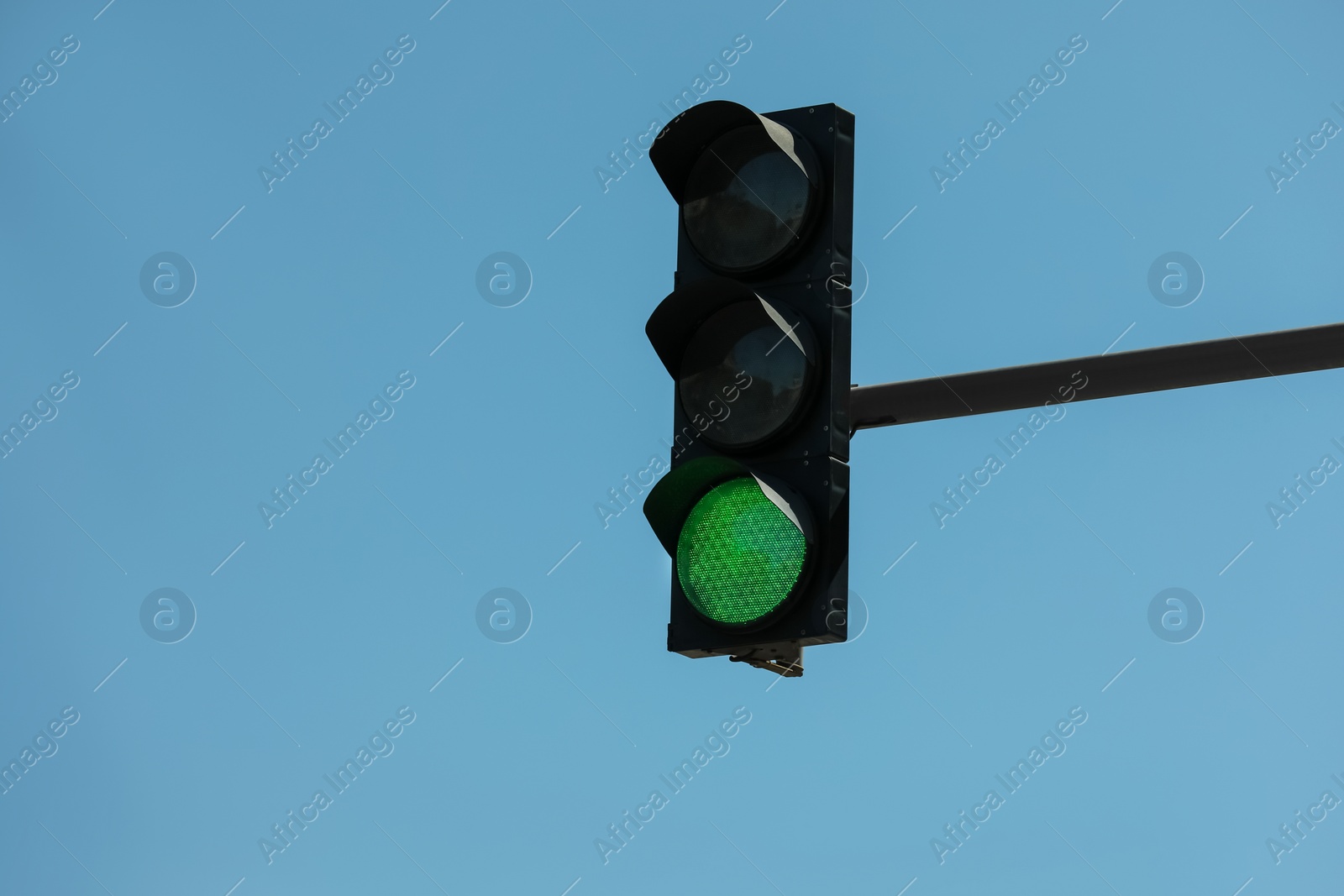 Photo of View of traffic light against blue sky