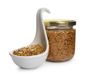 Photo of Jar and serving spoon with whole grain mustard on white background