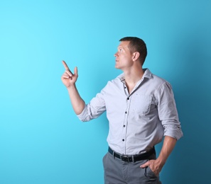 Photo of Handsome young man on color background