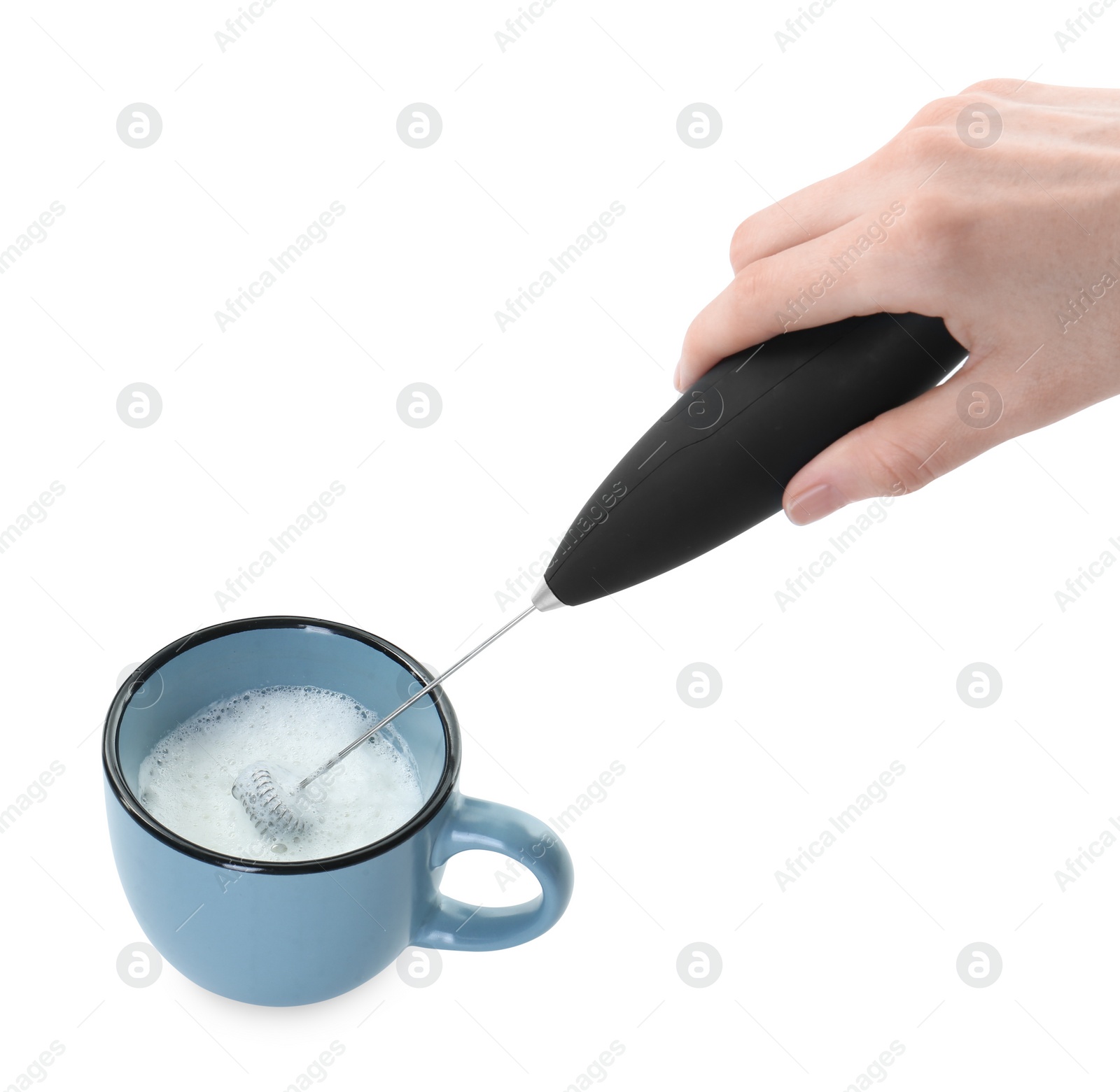 Photo of Woman whisking milk in cup with mini mixer (frother wand) isolated on white