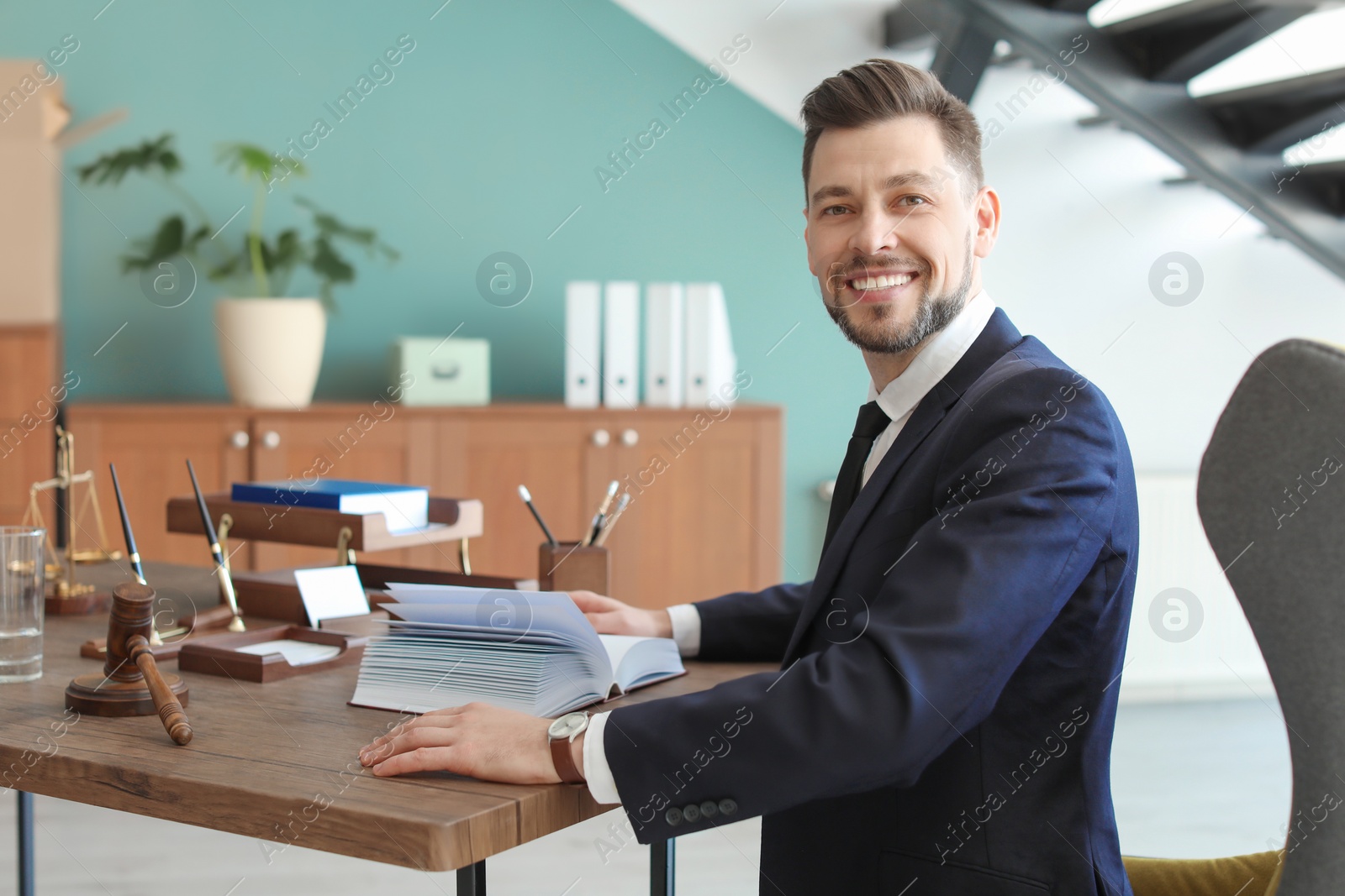 Photo of Male lawyer working in office