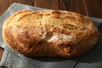 Photo of Freshly baked sourdough bread on wooden table