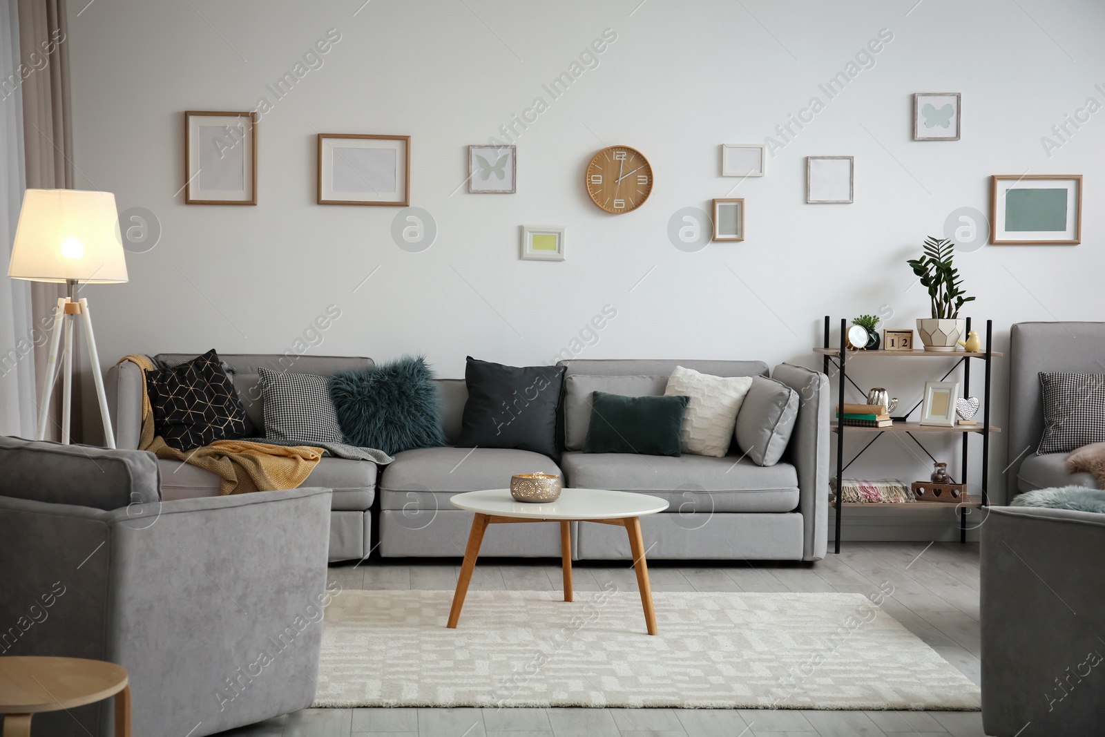 Photo of Modern living room interior with comfortable sofa and small table