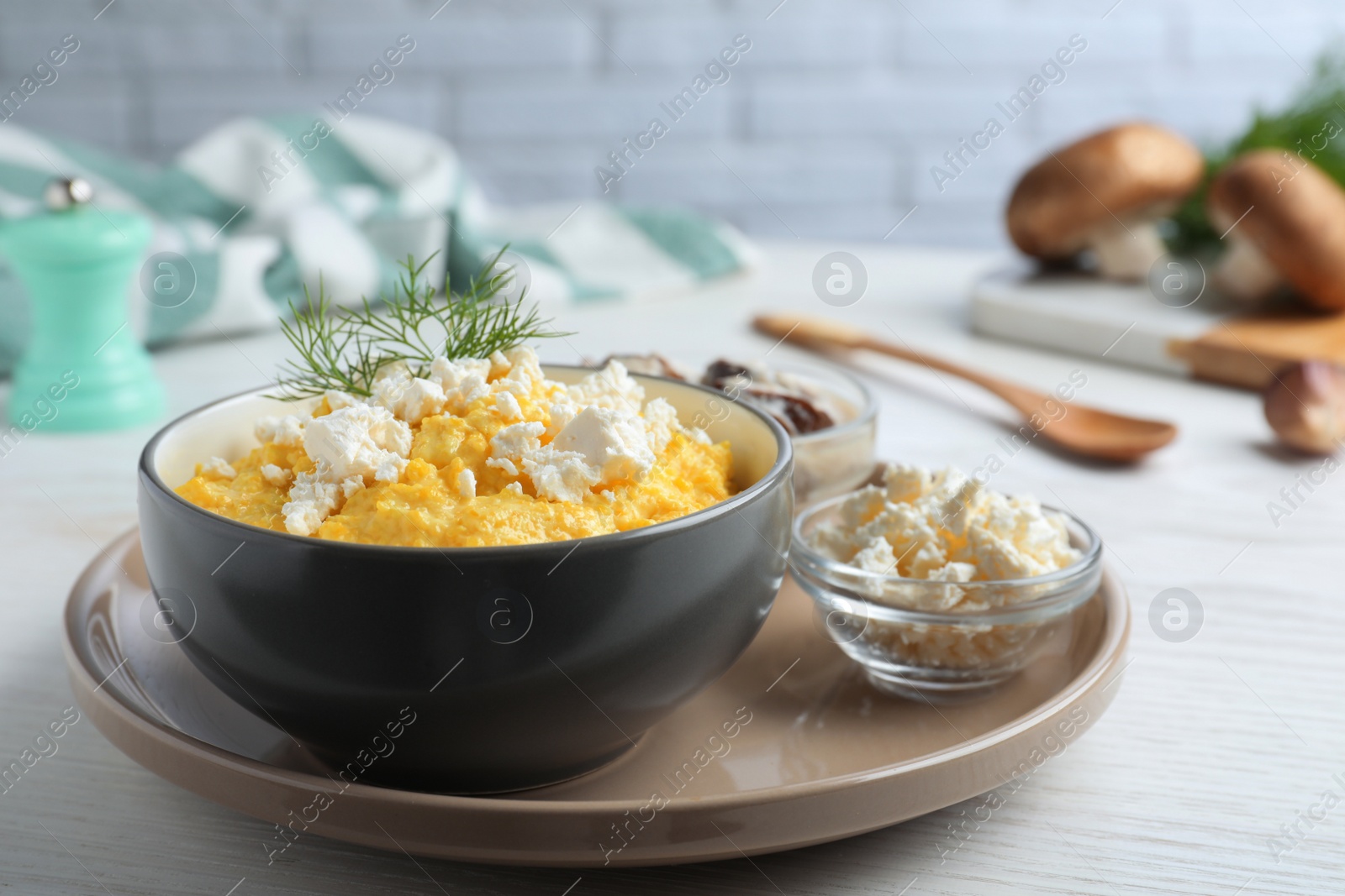 Photo of Delicious traditional banosh served on white wooden table