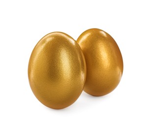 Two shiny golden eggs on white background