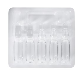 Photo of Glass ampoules with pharmaceutical product in tray on white background, top view