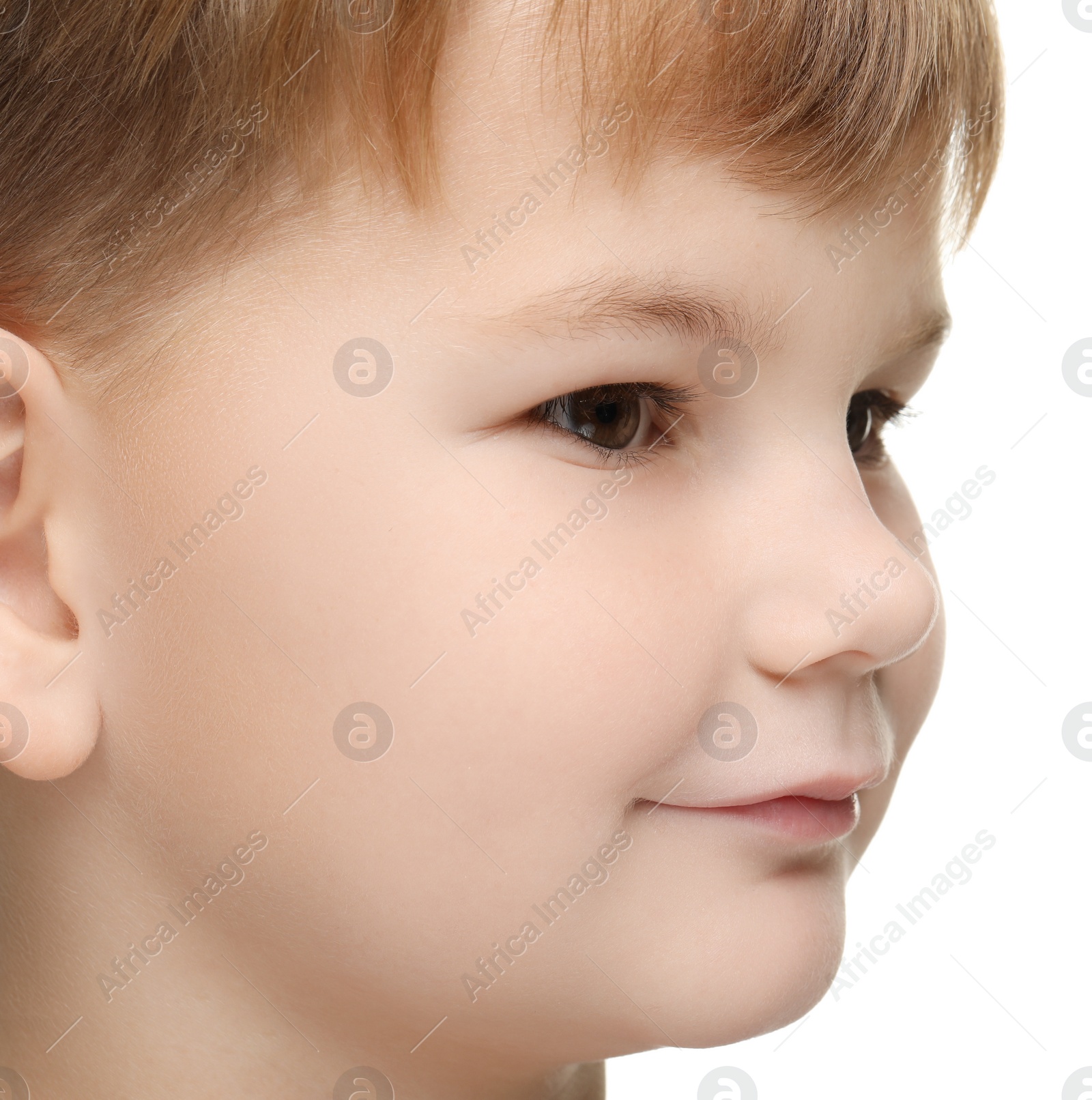 Photo of Portrait of cute little boy on white background, closeup