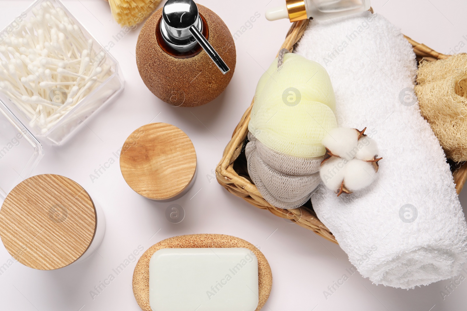 Photo of Bath accessories. Different personal care products and cotton flower on white background, flat lay