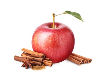 Image of Aromatic cinnamon sticks, anise star and red apple isolated on white