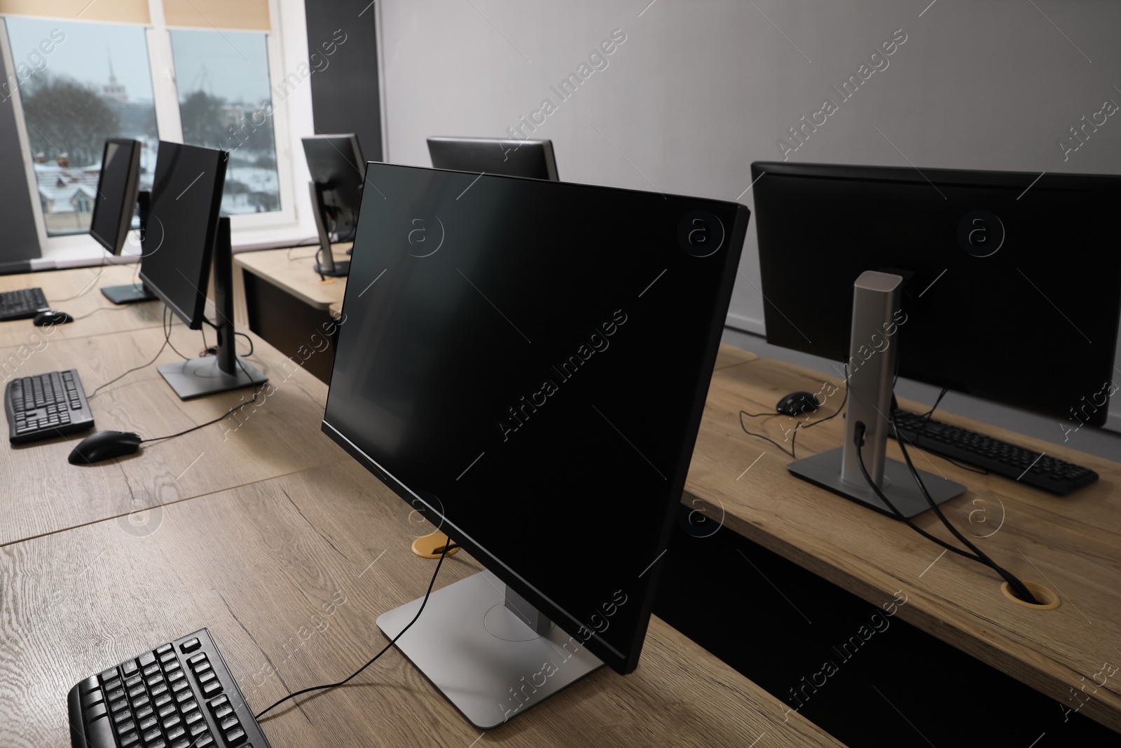 Photo of Many modern computers in open space office