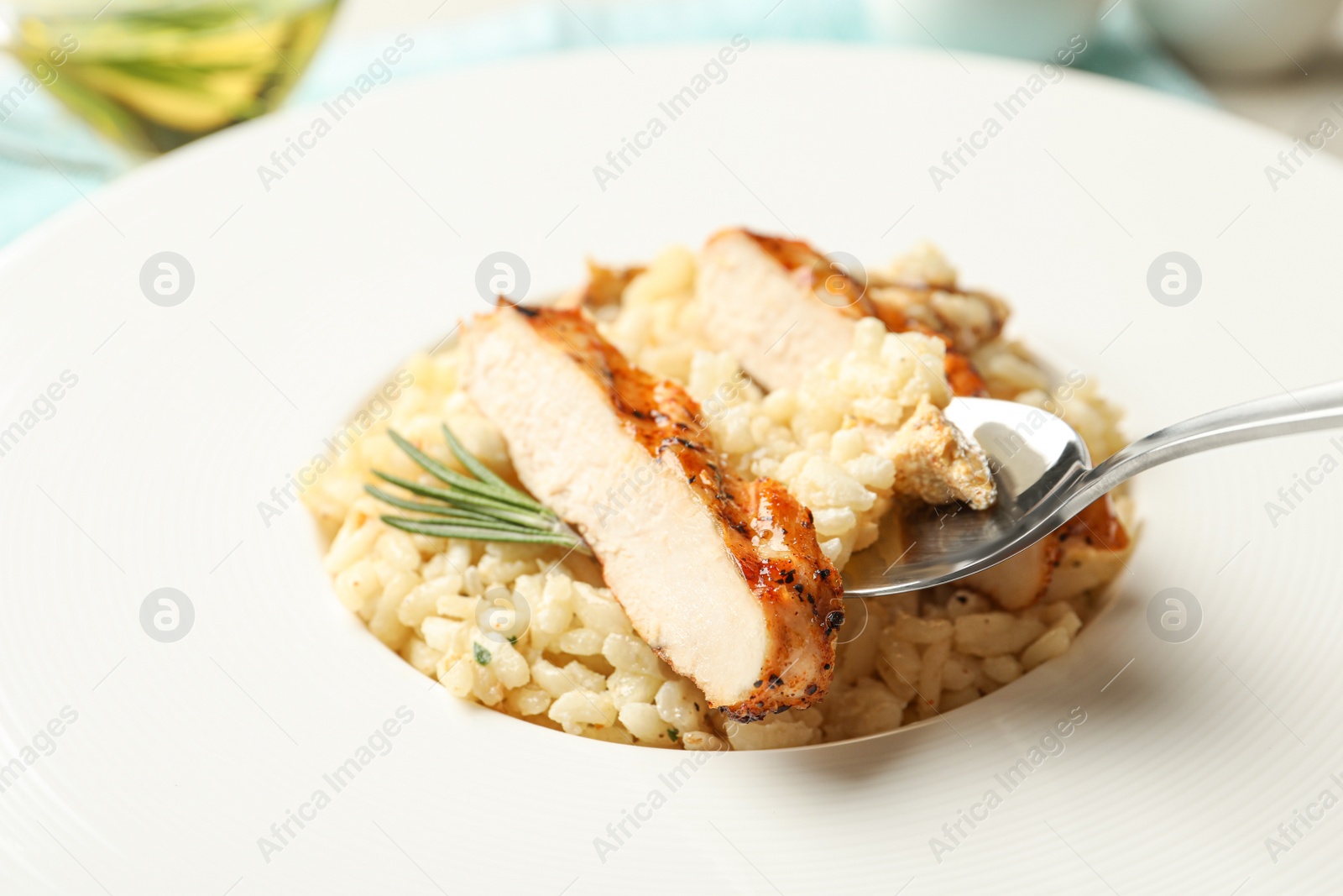 Photo of Delicious fresh chicken risotto in plate, closeup