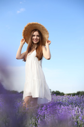 Young woman in lavender field on summer day