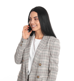 Photo of Beautiful young businesswoman talking by phone on white background