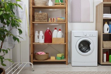 Laundry room interior with washing machine and furniture