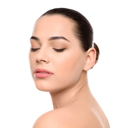 Portrait of young woman with beautiful face and natural makeup on white background