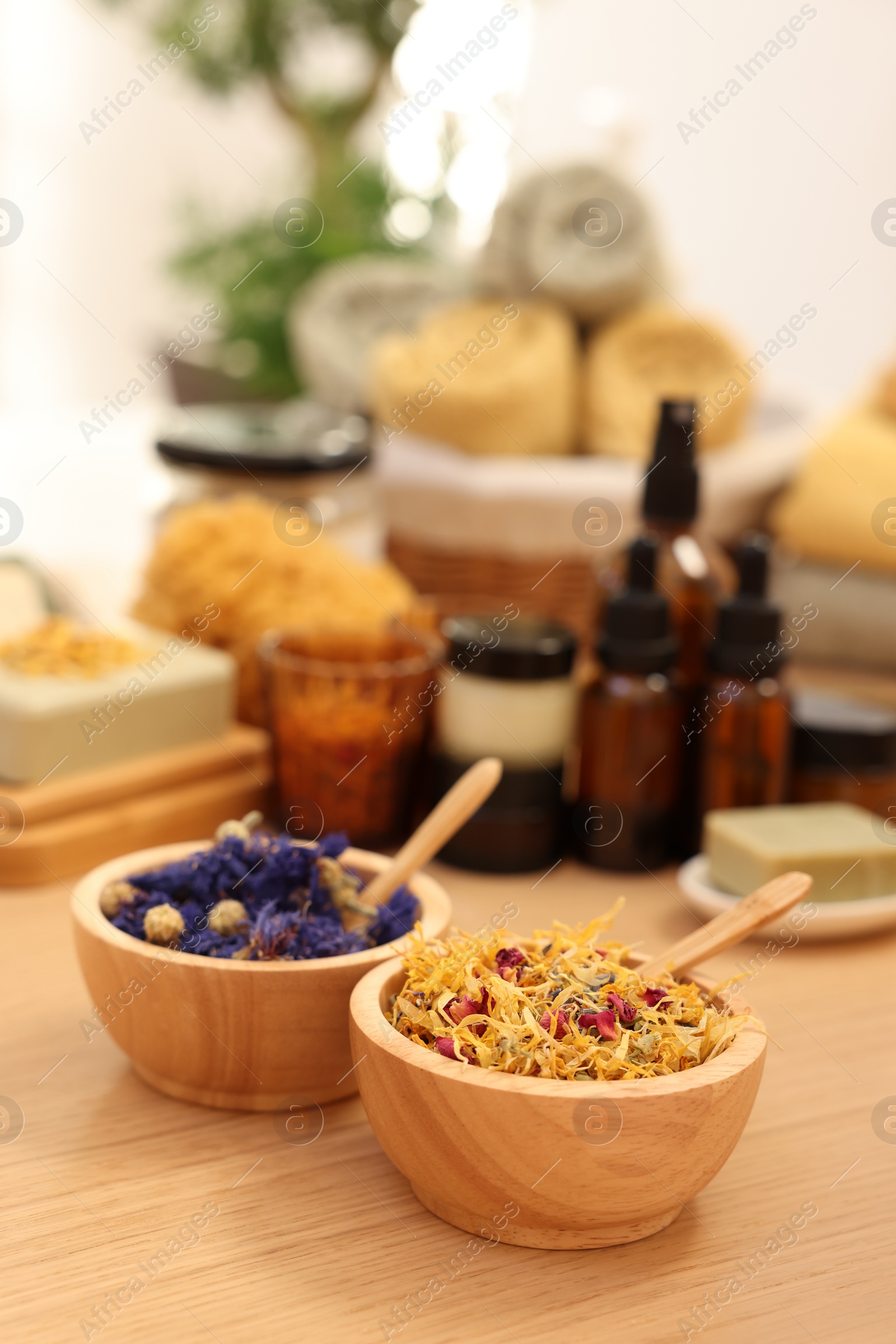 Photo of Dry flowers on wooden table indoors, space for text. Spa time