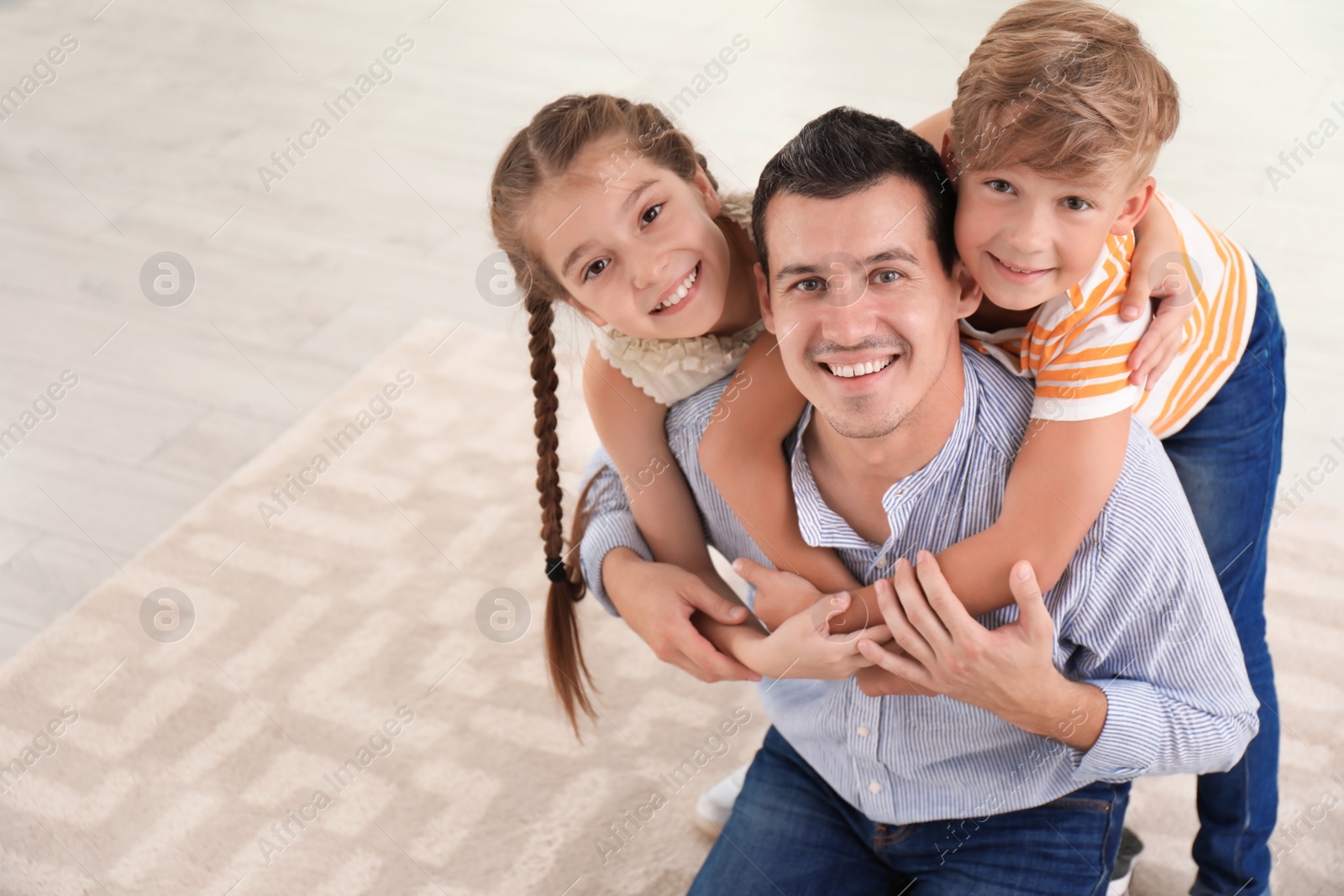 Photo of Father with cute children at home. Happy family