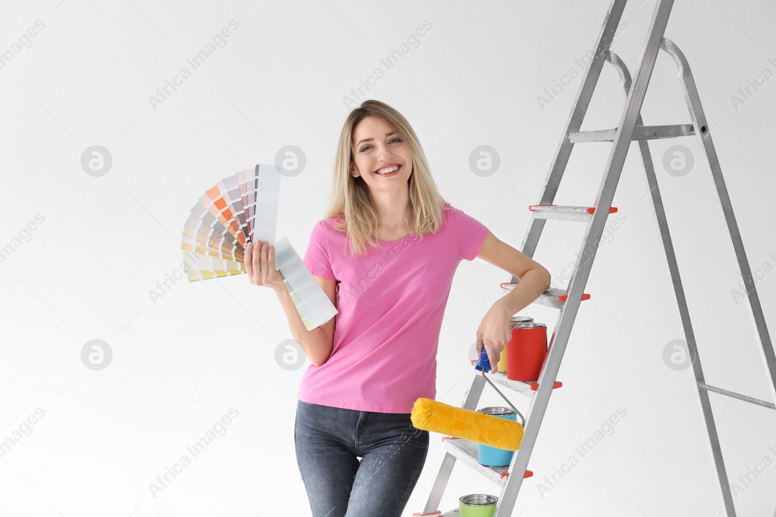 Photo of Young woman with color palette on white background