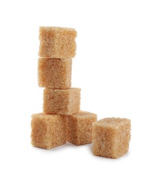 Photo of Cubes of brown sugar on white background