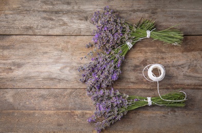 Flat lay composition with lavender flowers on wooden background